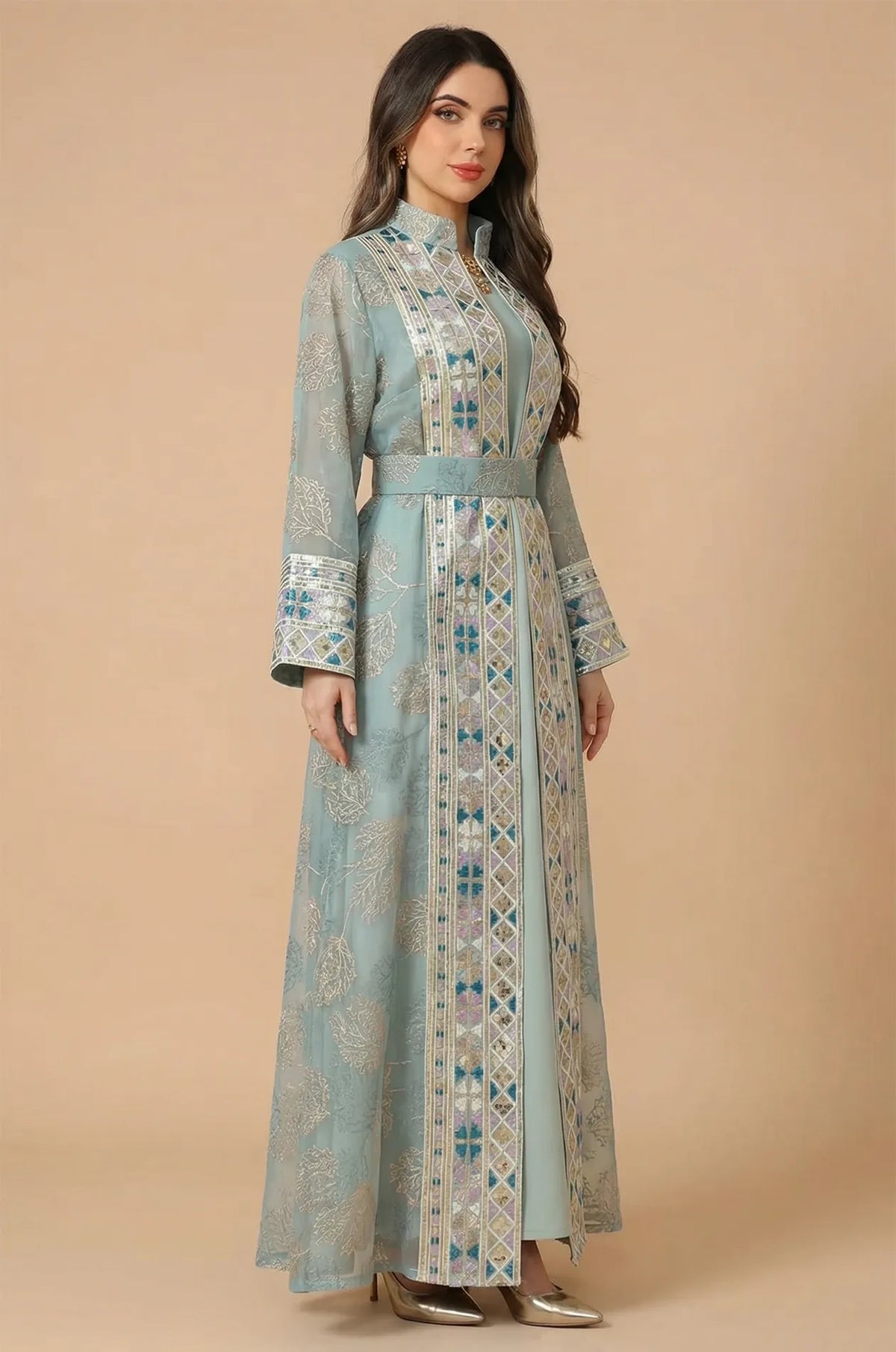 Side profile of the Gienah light green chic kaftan, highlighting the fluid silhouette and detailed sleeve craftsmanship.