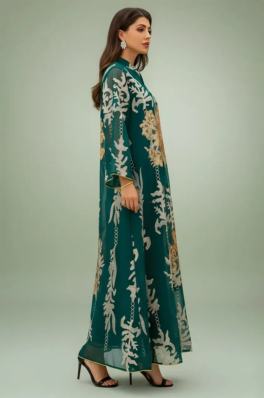 Side profile of the emerald green Maliya flower kaftan showing the sheer organza fabric and gold sequin floral details.