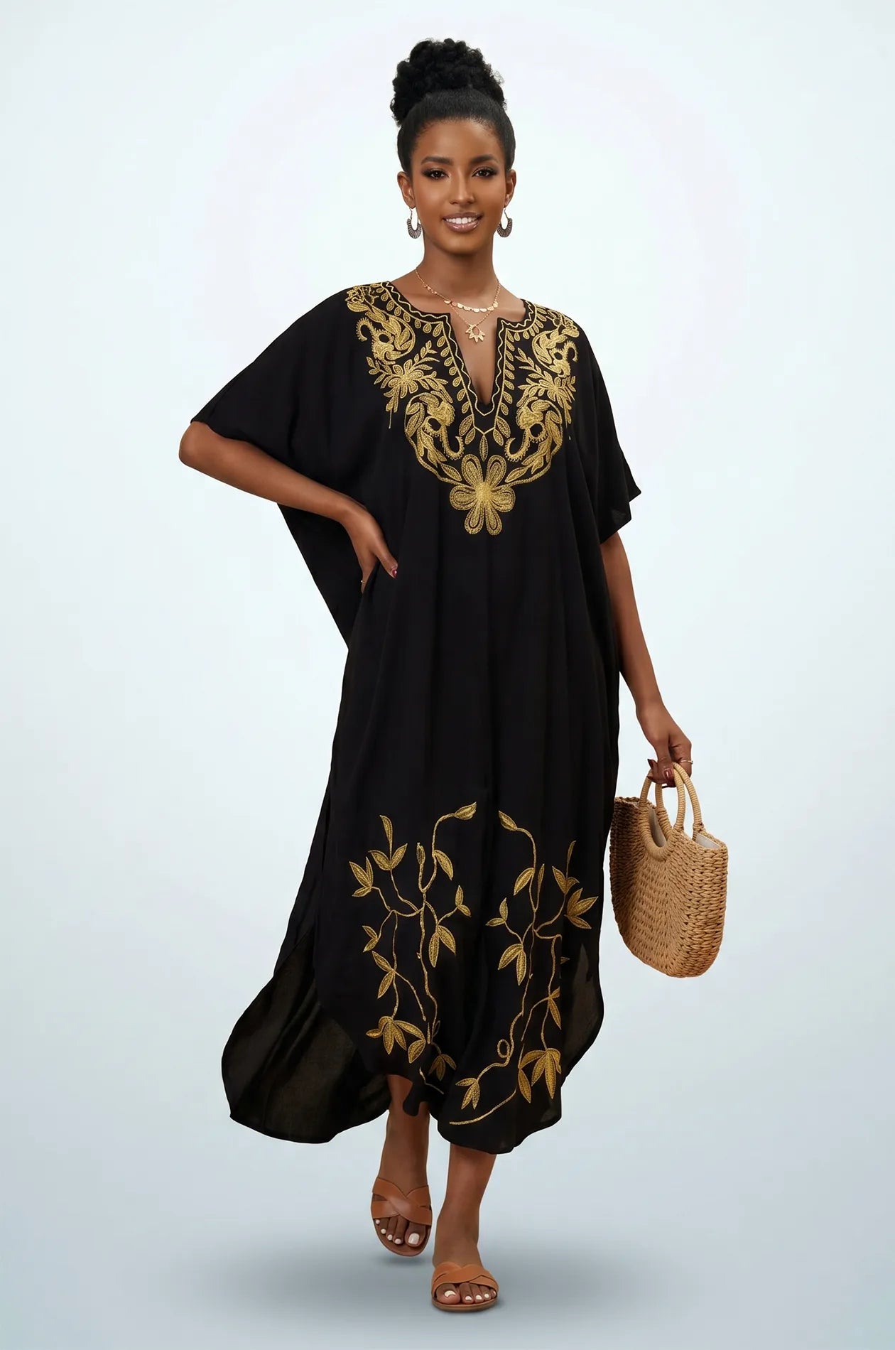 Naylara Halia black long kaftan styled with raffia tote bag — front view studio