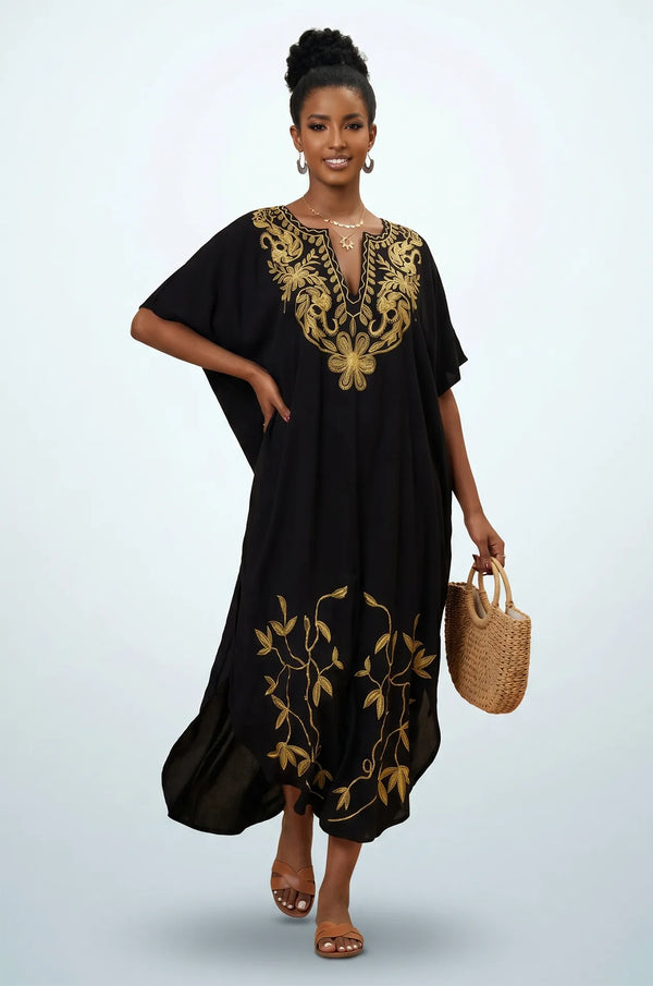 Naylara Halia black long kaftan styled with raffia tote bag — front view studio