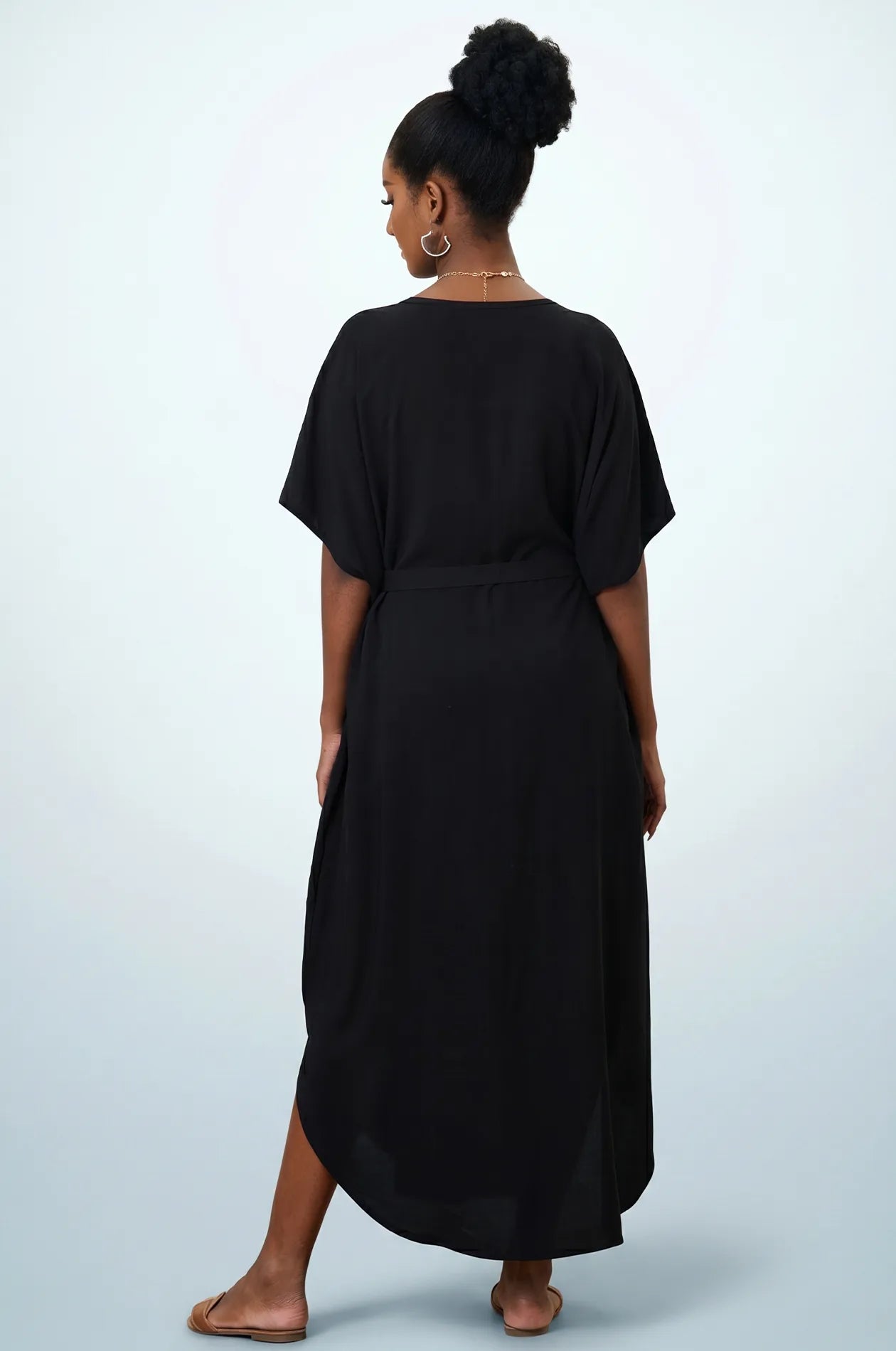 Naylara Halia black long kaftan with gold floral neckline embroidery — front standing studio