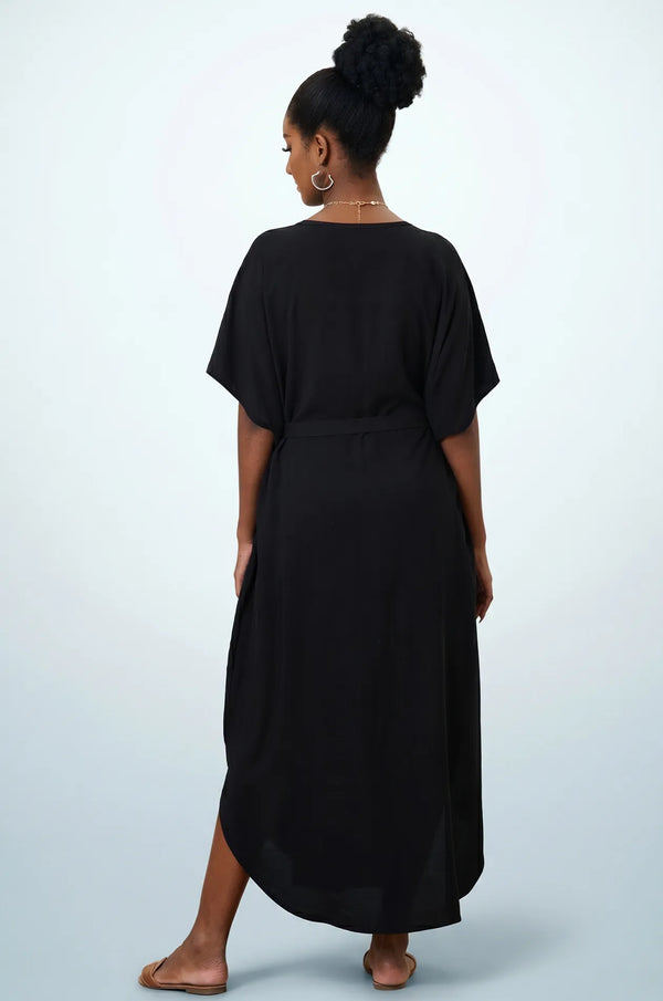 Naylara Halia black long kaftan with gold floral neckline embroidery — front standing studio