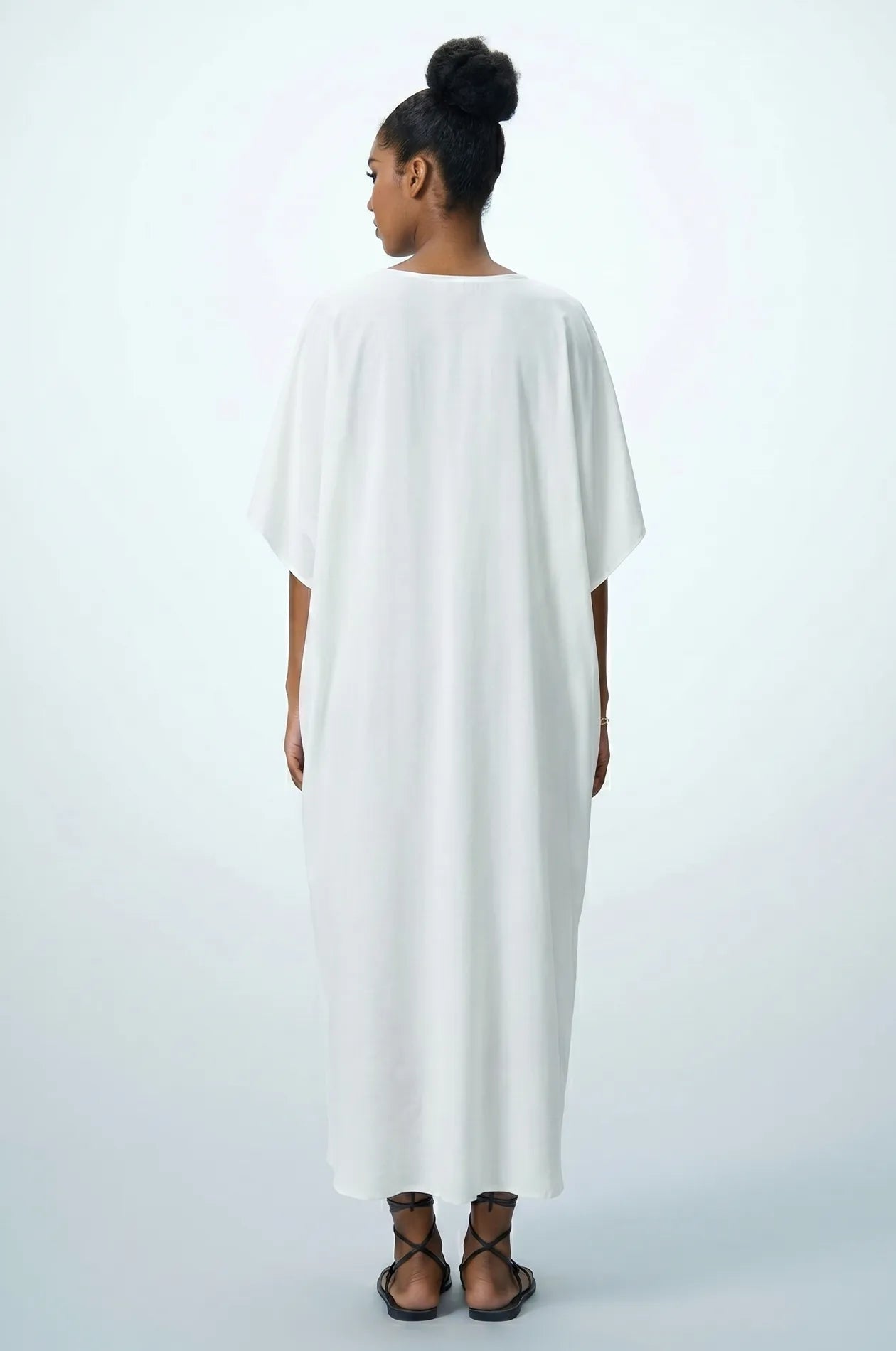 Back view of Naylara Halia white long kaftan beach cover up — full length studio