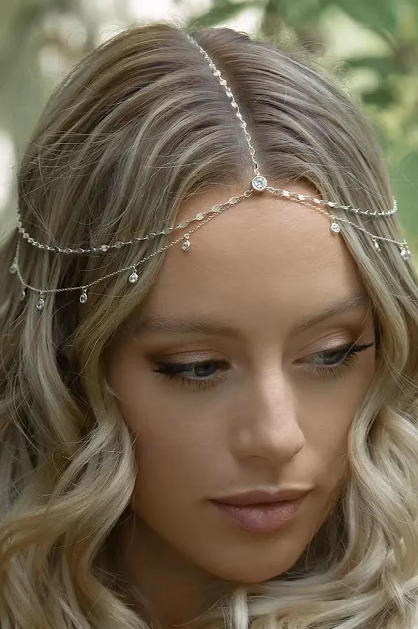 Model wearing the dainty rhinestone head chain across the forehead.