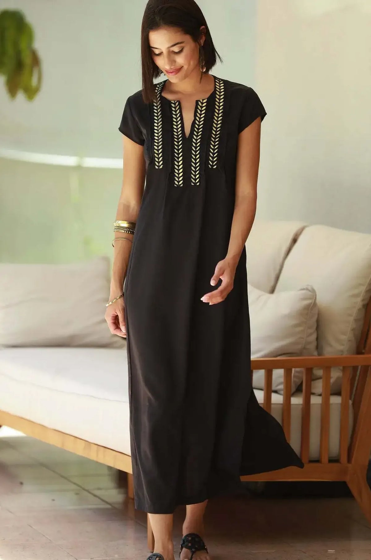 Naylara Iara black embroidered kaftan worn indoors — casual resort lifestyle look