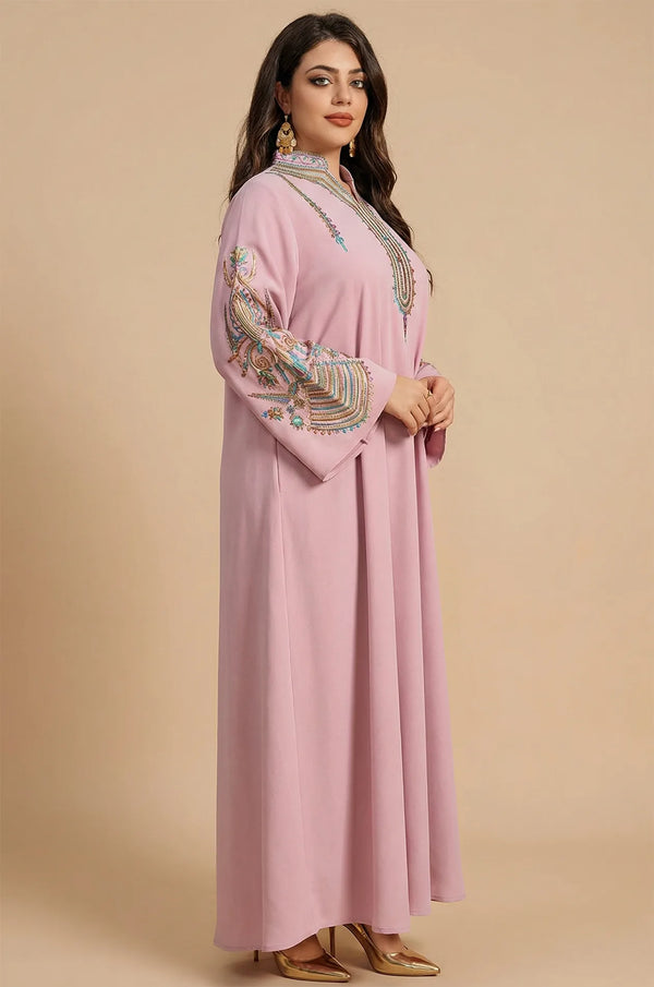 Side profile of the Inez Pink Jalabiya Kaftan showing the elegant drape and decorative sleeve embroidery against a neutral background.