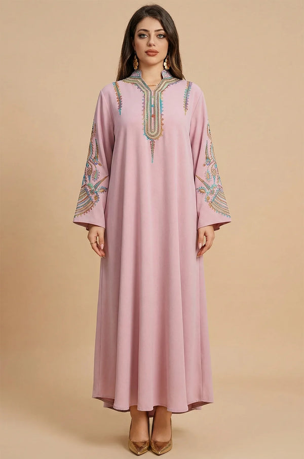 Studio front view of the Inez Pink Jalabiya Kaftan featuring traditional embroidery on a modest, floor-length gown.