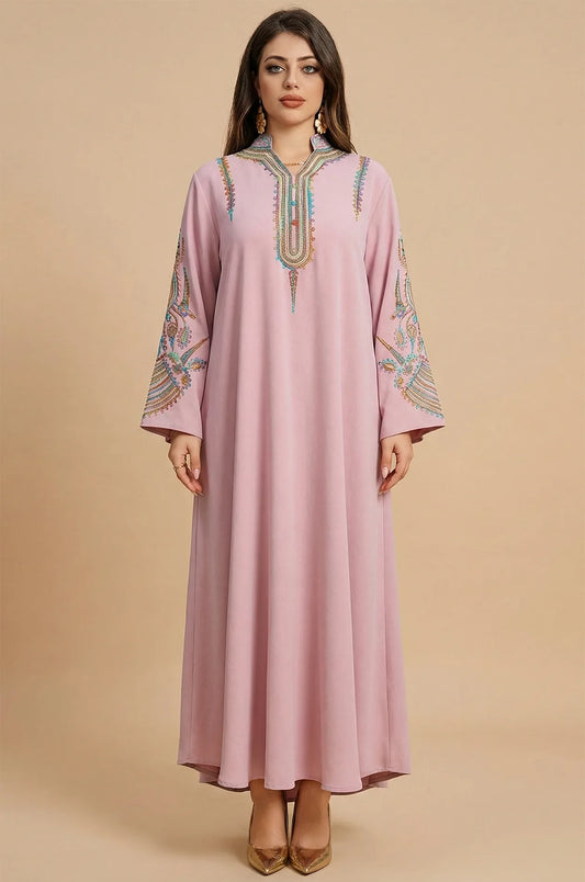 Studio front view of the Inez Pink Jalabiya Kaftan featuring traditional embroidery on a modest, floor-length gown.
