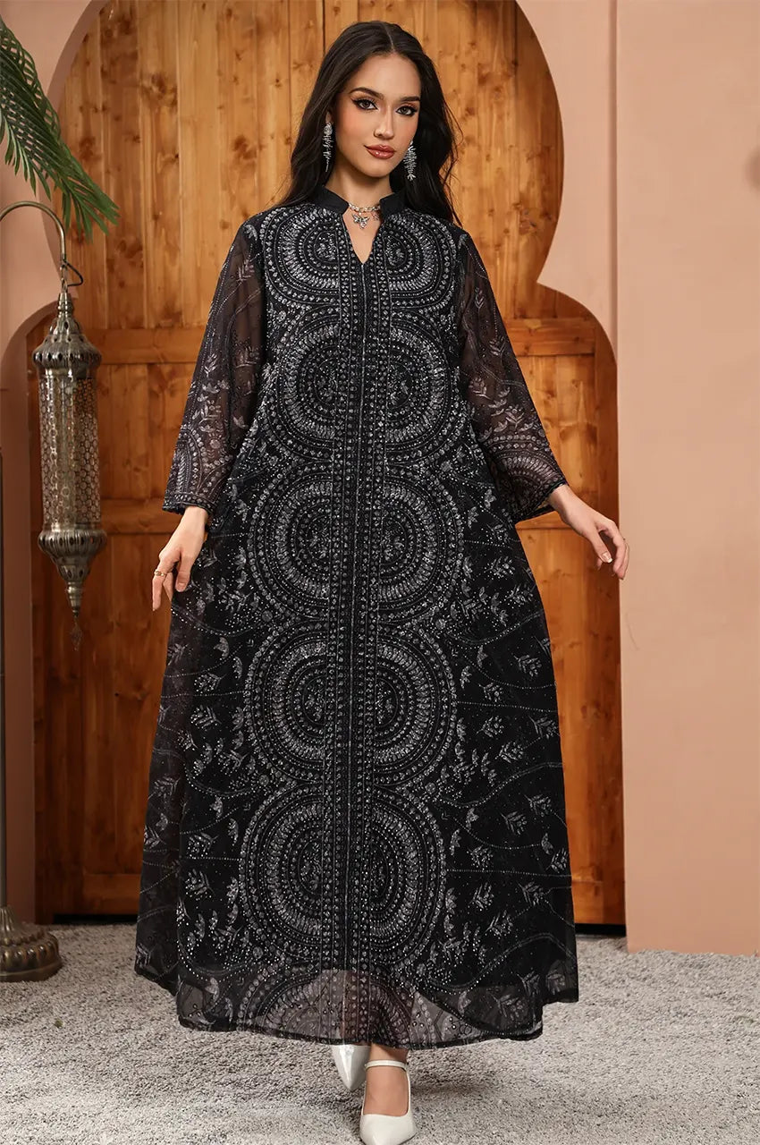 Full front view of the Kaly Black sheer maxi kaftan by Naylara featuring intricate circular embroidery and a floor-length silhouette.