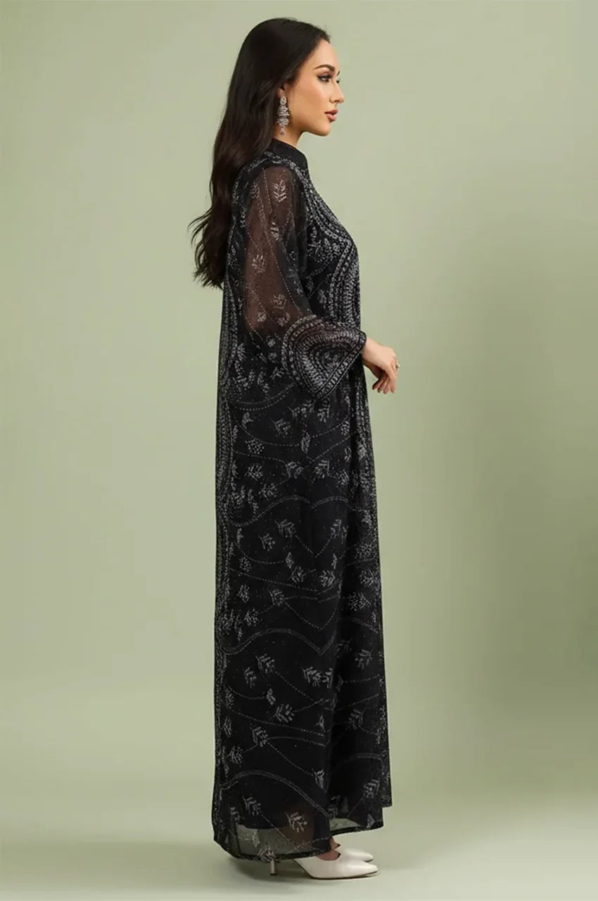 Side profile of the Kaly Black sheer maxi kaftan demonstrating the fluid drape and elegant floor-sweeping cut.