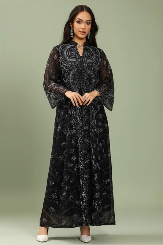 Studio shot of the Kaly Black sheer maxi kaftan showcasing the lightweight georgette fabric and wide flared sleeves.