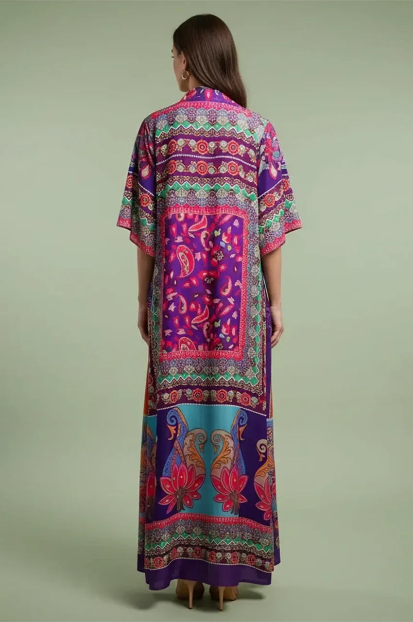 Back view of the Naylara Kimia orange Indian kaftan night dress, highlighting the continuous border print and elegant floor-length silhouette.