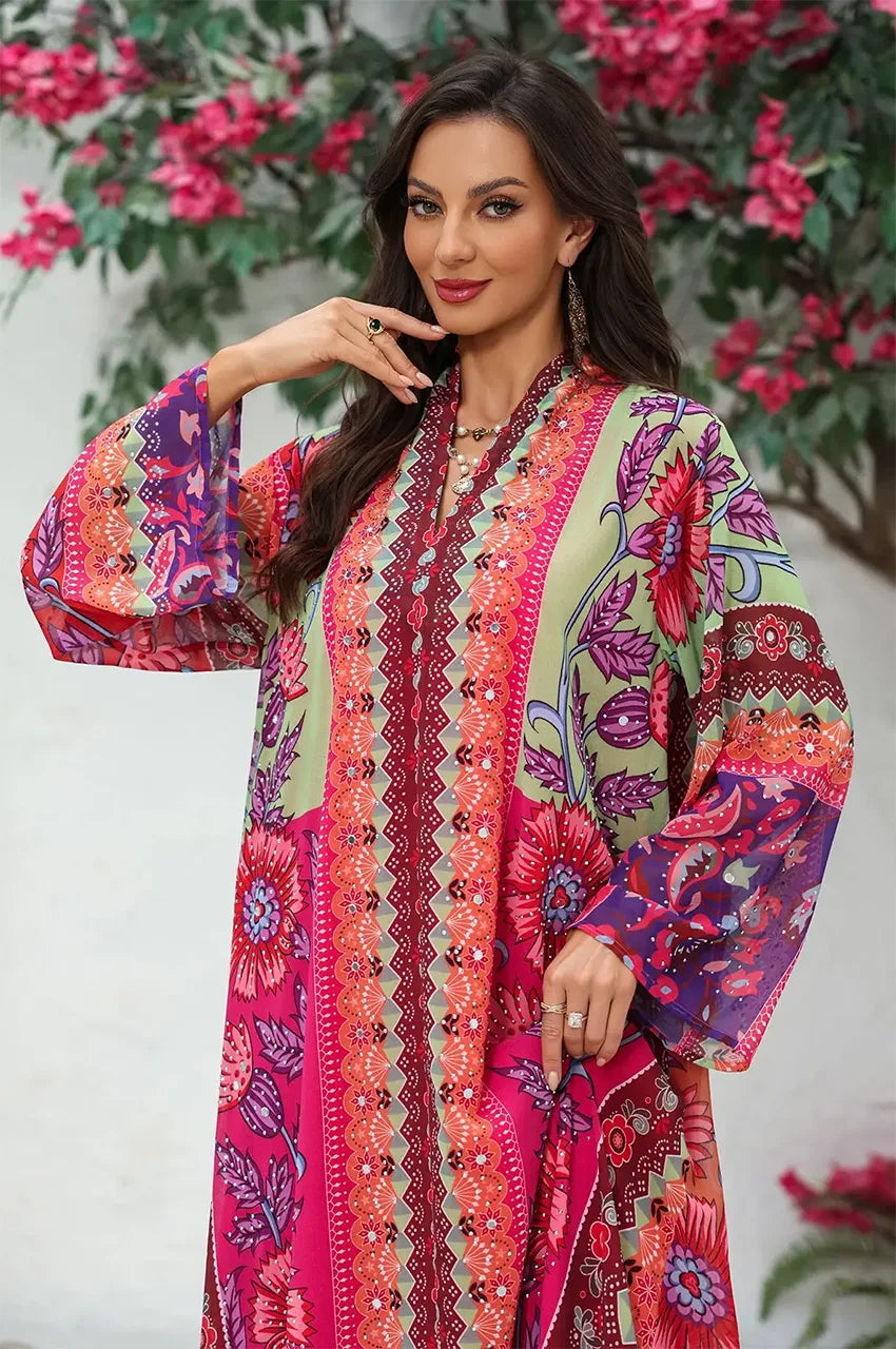 Upper body detail of the Kimia orange Indian kaftan night dress, focusing on the vibrant color palette and decorative sfifa trim.