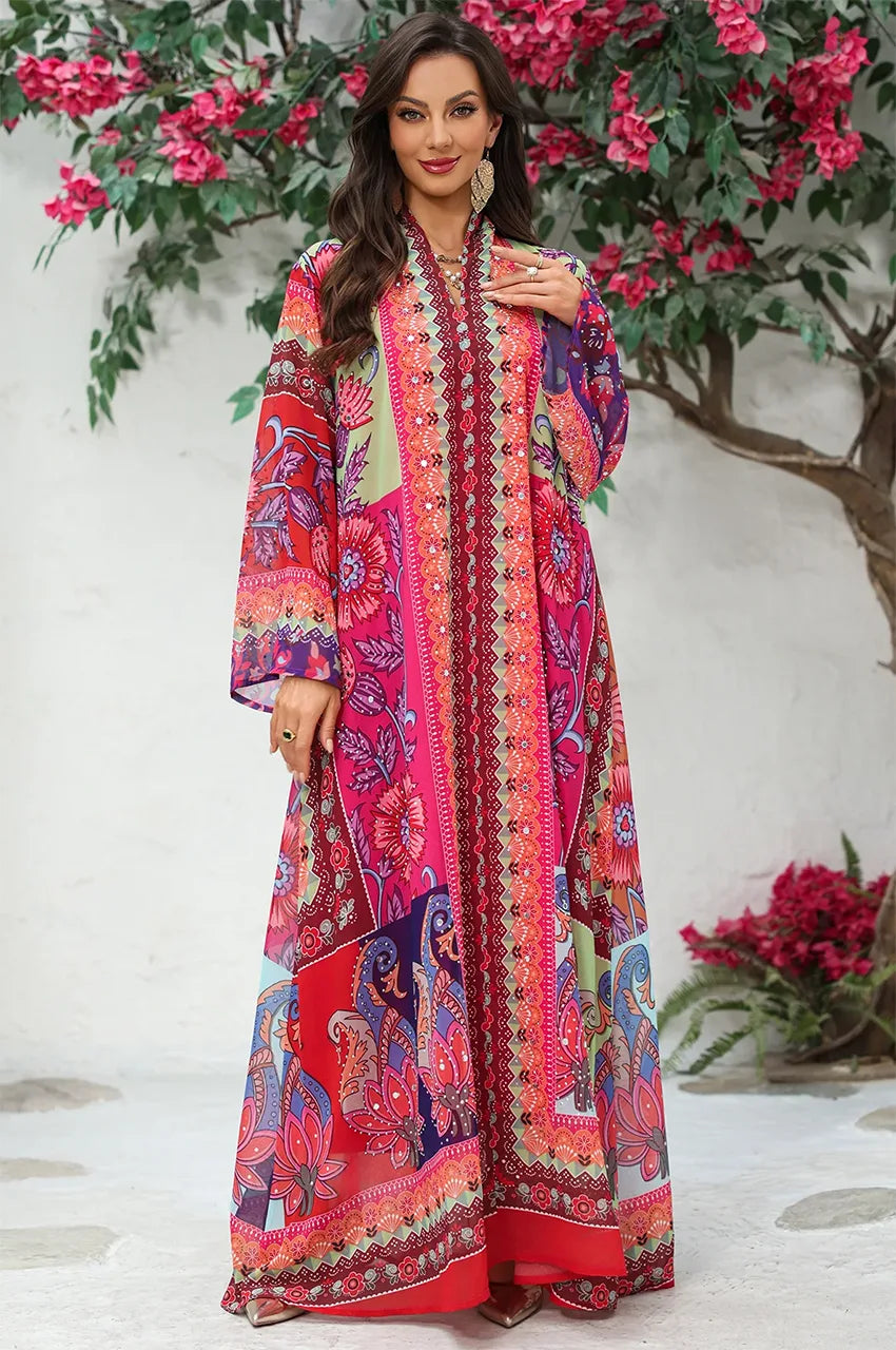 Professional outside shot of the Naylara Kimia orange Indian kaftan night dress.