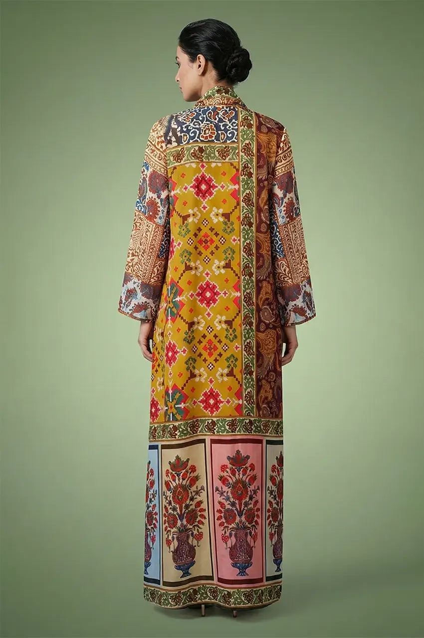 Rear view of the Kimia red Indian kaftan night dress highlighting the continuous geometric border prints and floor-length silhouette.