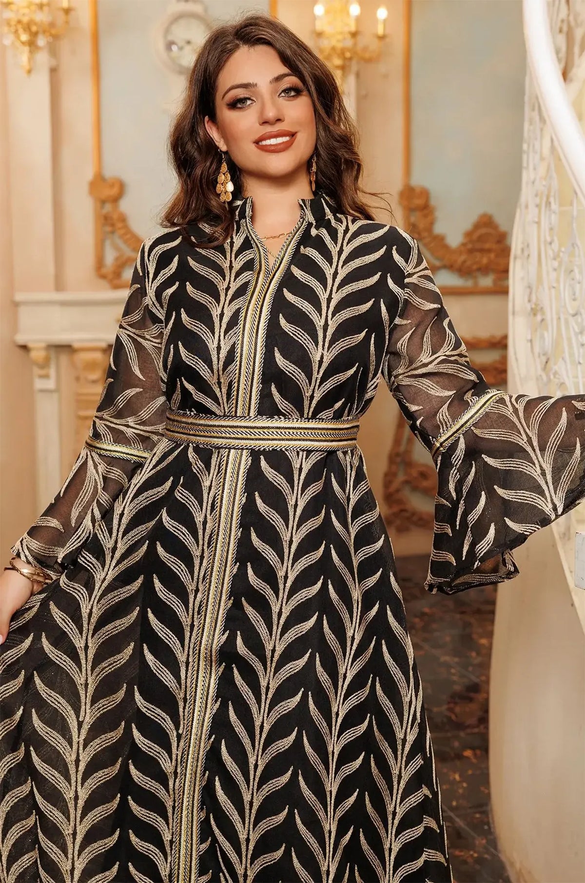 Detailed close-up of the upper body of the Kitala Kaftan, focusing on the high mandarin collar, braided gold belt, and ruffled bell sleeve transition.