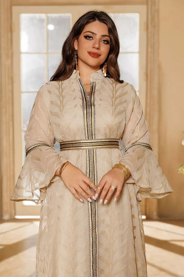 Detailed view of the ruffled bell sleeves and braided gold belt on the ivory beige Kitala Elegant Moroccan Kaftan.