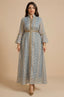 Full-length front view of the light blue Kitala Elegant Moroccan Kaftan by Naylara featuring metallic gold leaf embroidery and ruffled bell sleeves on a neutral background.
