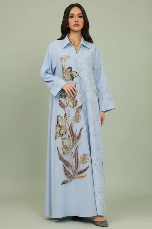 Full front view of the Naylara Lamiya Light Blue a line kaftan dress featuring a contrasting botanical leaf print and elegant modest silhouette.