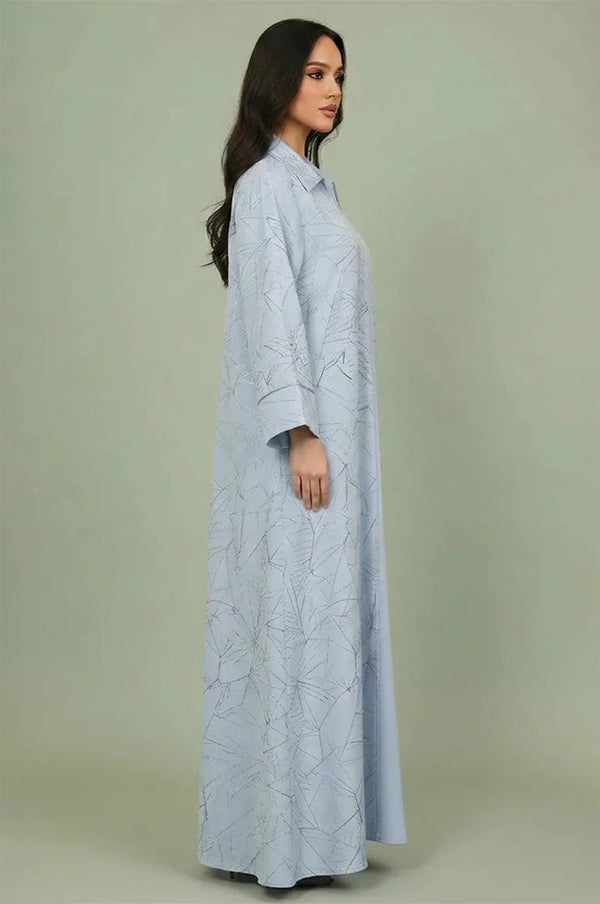 Side profile of the Lamiya Light Blue a line kaftan dress demonstrating the fluid A-line drape and intricate hand-applied sequin detailing.
