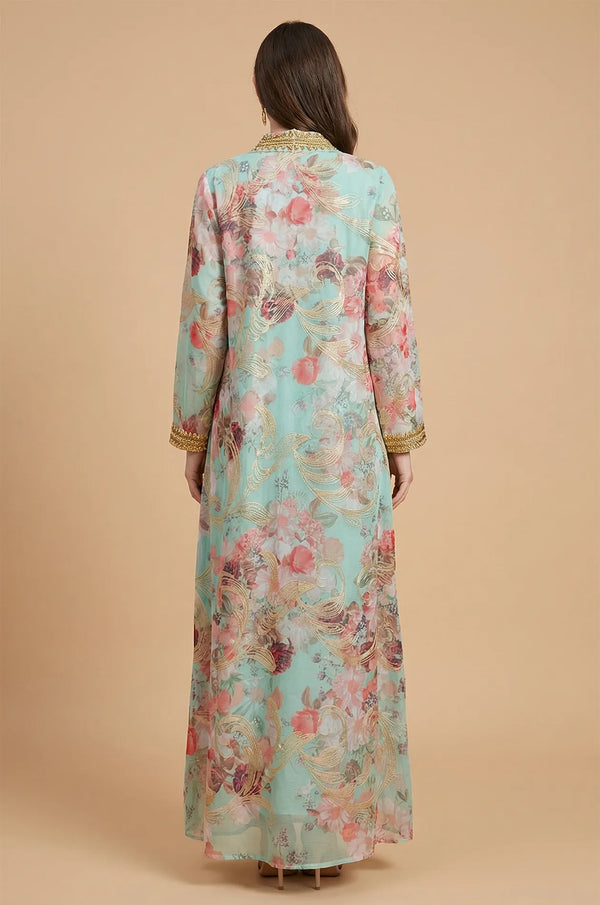 Rear view of the blue Lyrae floral kaftan showing the continuous rose pattern and elegant gold trim on the back.