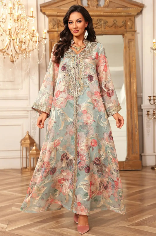 Elegant full-length shot of the green Lyrae vintage embroidered kaftan in a luxury interior setting.