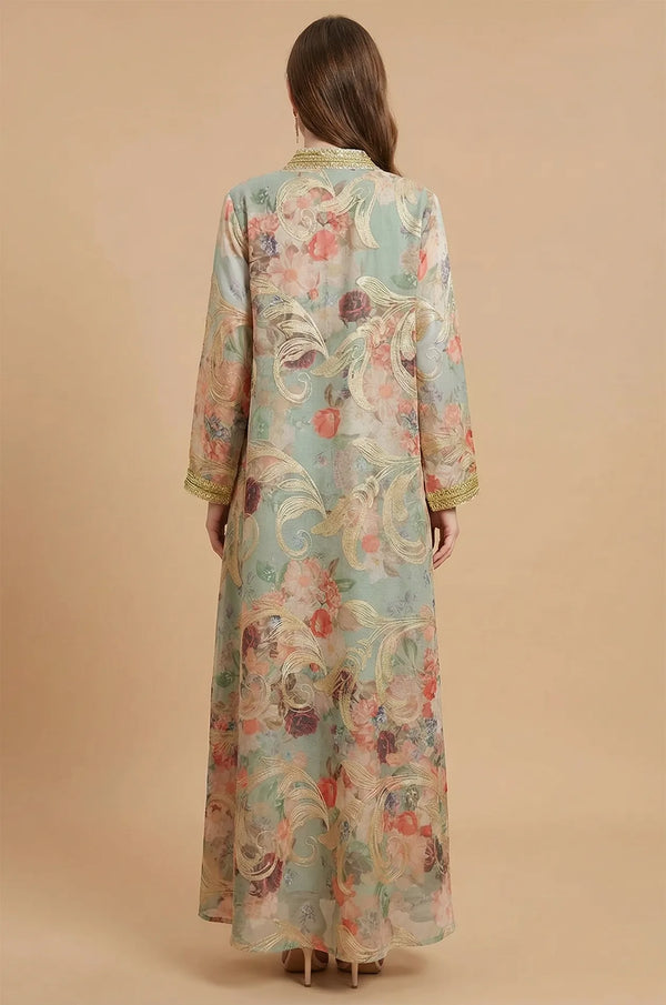 Rear view of the green Lyrae floral kaftan highlighting the gold embroidery on the back and the flowing silhouette.