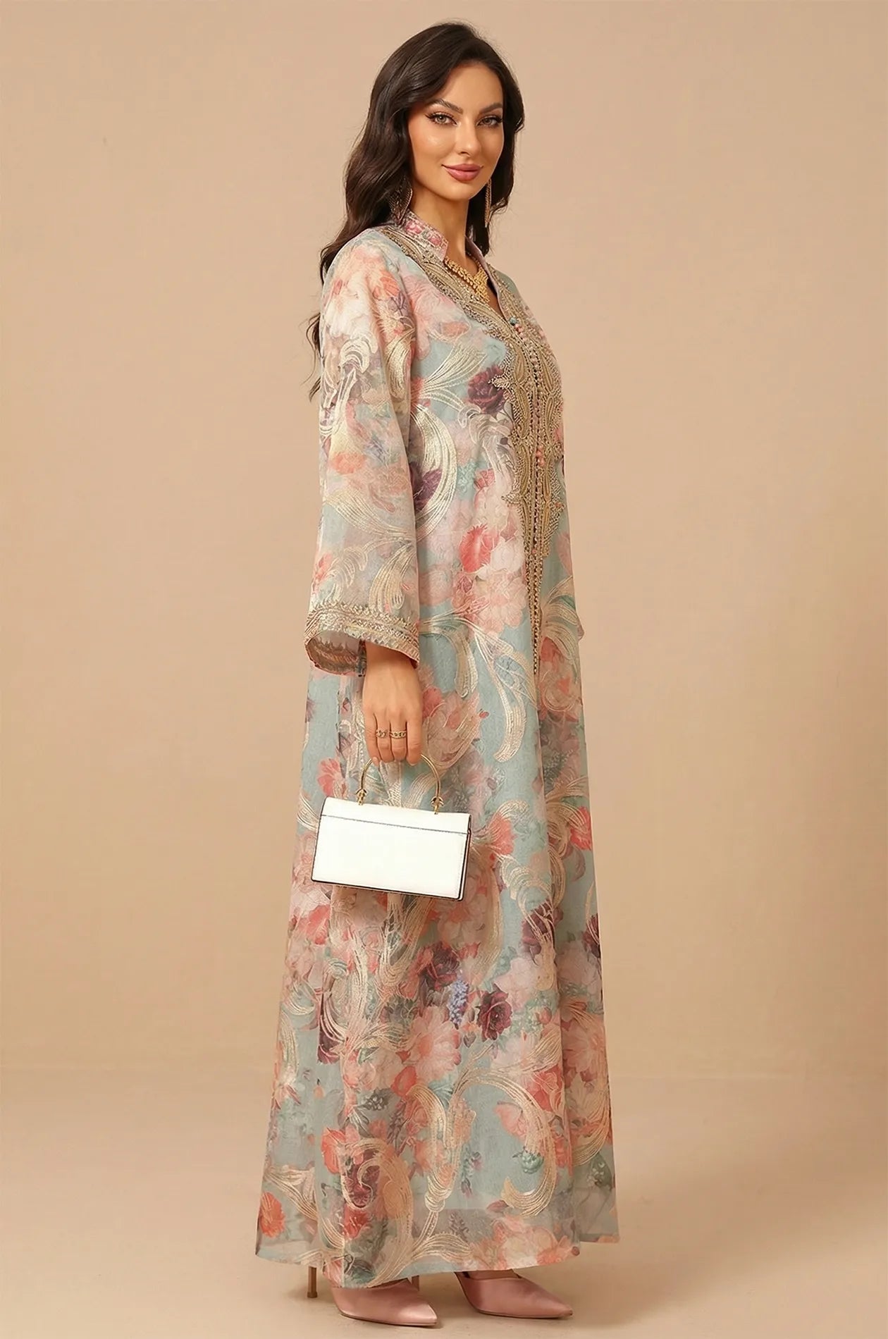 Side profile of the Naylara Lyrae green vintage embroidered kaftan showing the delicate sleeve details and rose pattern.