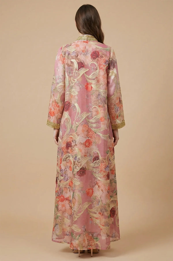 Rear view of the pink Lyrae floral kaftan showcasing the flowing silhouette and continuous gold-trimmed rose pattern.