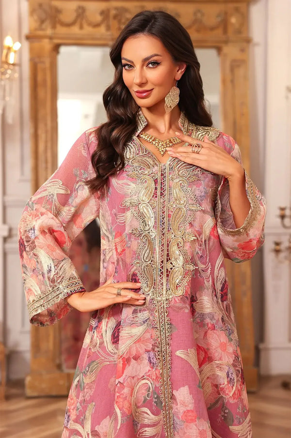 Detailed medium shot of the pink Lyrae kaftan focusing on the gold sfifa artisanal braiding and intricate paisley embroidery.