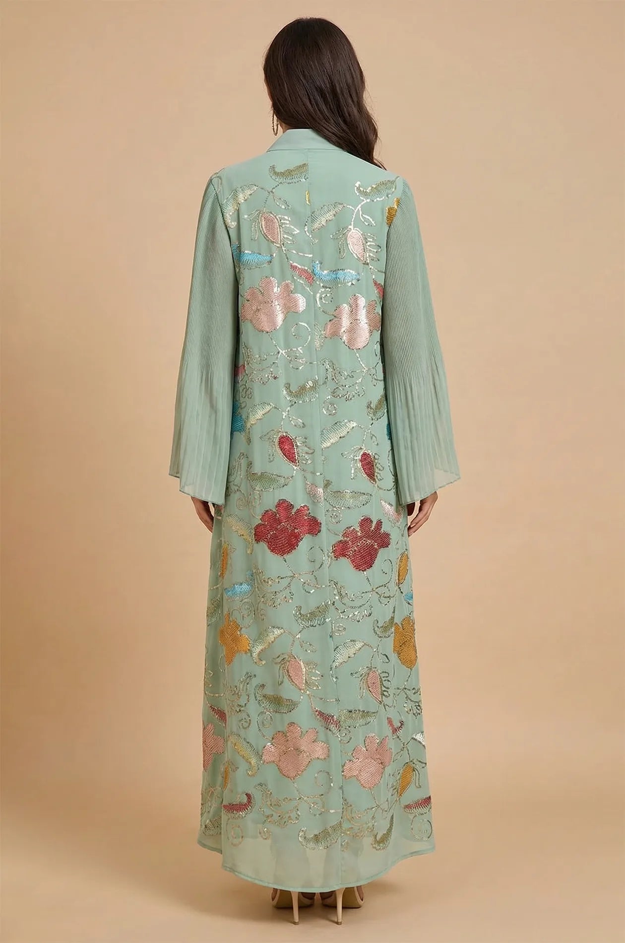 Rear view of the Marylin Green Tassel Kaftan showcasing the continuous floral sequin patterns and the flowy maxi silhouette.