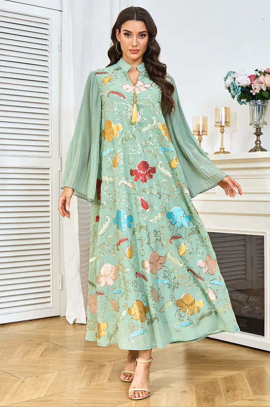 Elegant presentation of the Marylin Green Tassel Kaftan by Naylara, displaying the full-length drape and multicolored motifs.