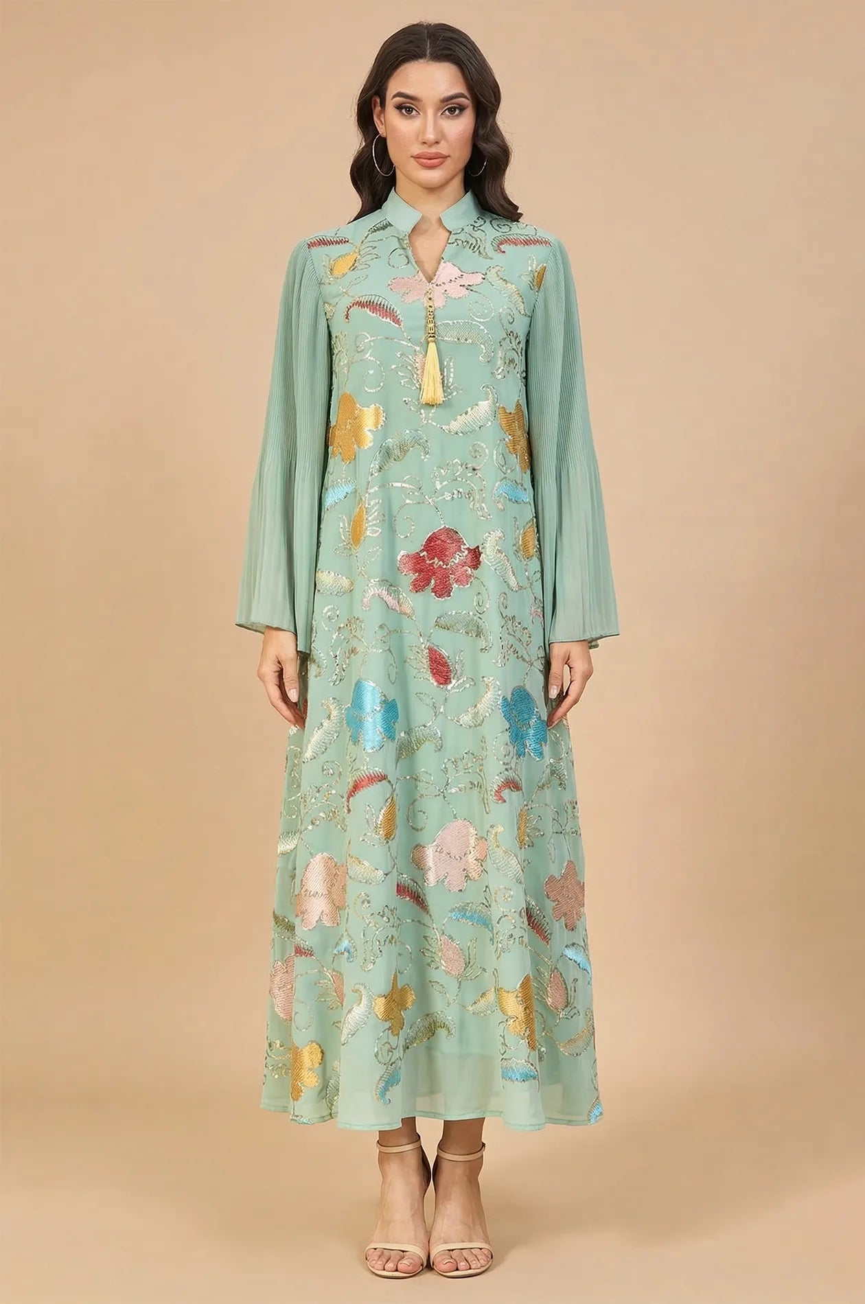 Full-length front view of the Marylin Green Tassel Kaftan by Naylara, featuring vibrant floral sequin embroidery and a gold tassel.