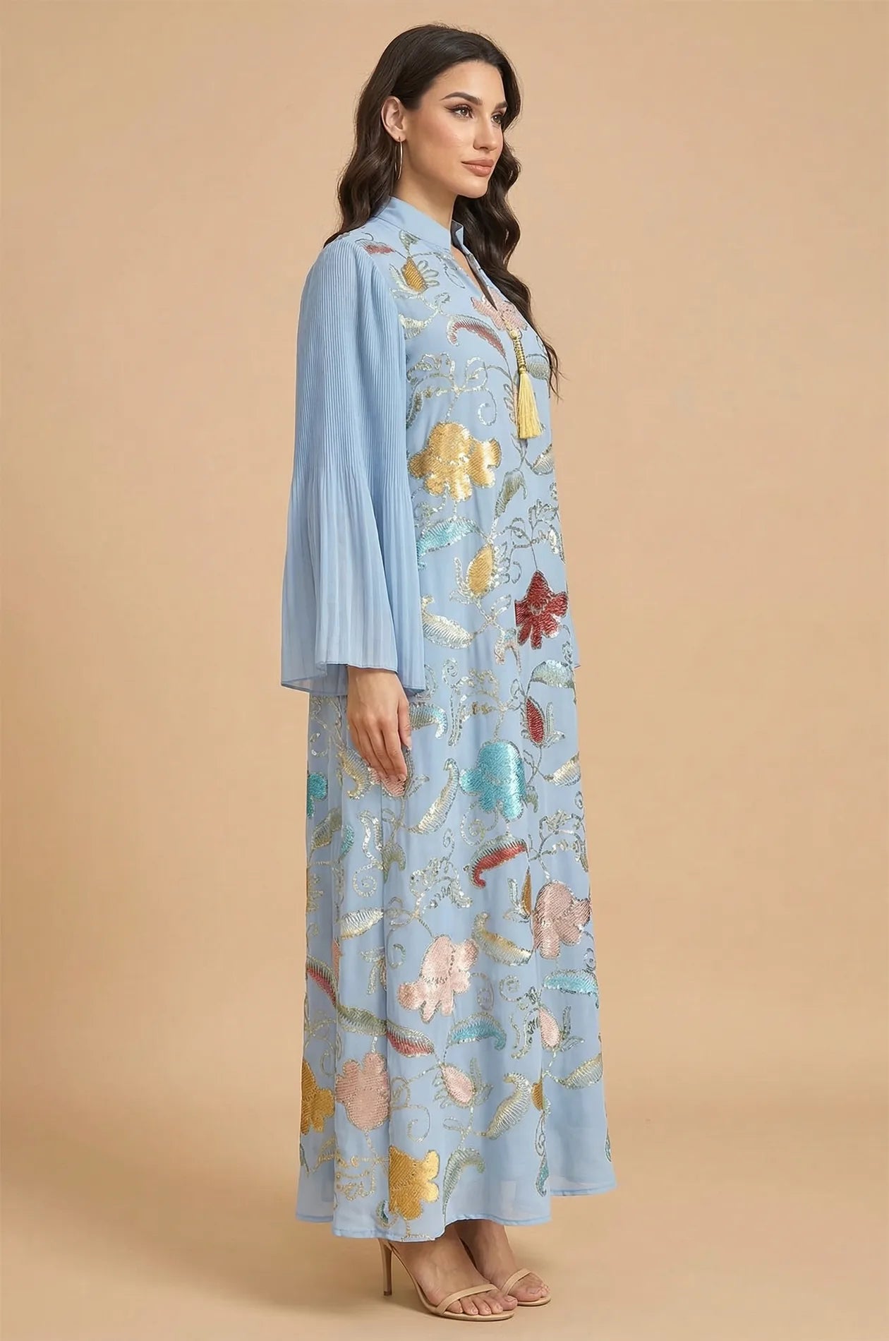 Side profile of the Marylin Light Blue Kaftan showcasing the pleated bell sleeves and elegant floor-length silhouette.