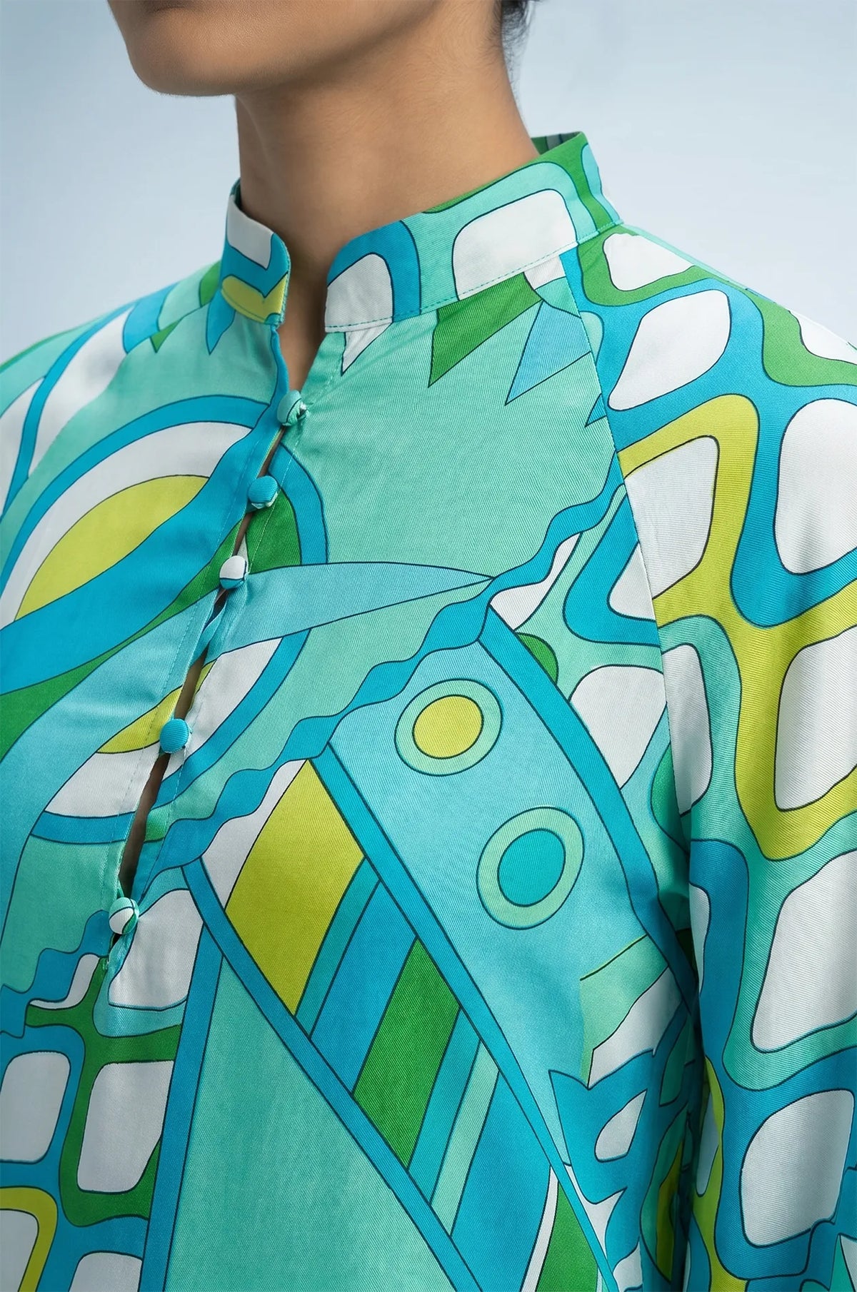 Macro detail of Naylara Myrtle kaftan Mandarin collar and covered button placket
