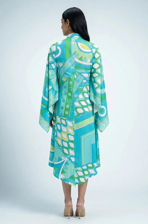 Back view of Naylara Myrtle teal geometric print kaftan showing wide cape sleeves
