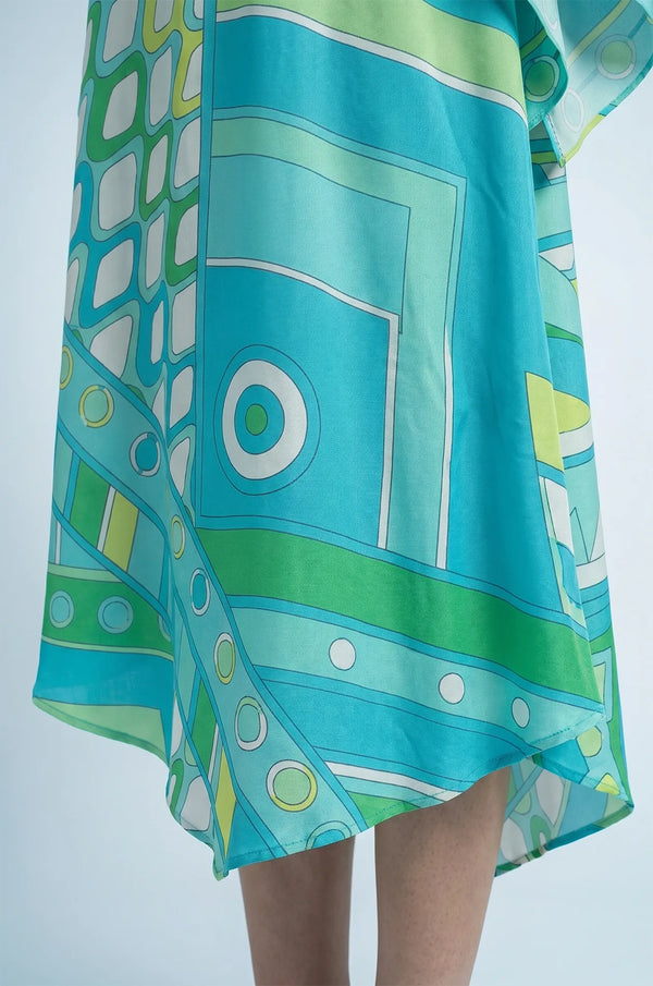 Detail of Naylara Myrtle teal geometric print kaftan asymmetric pointed hem