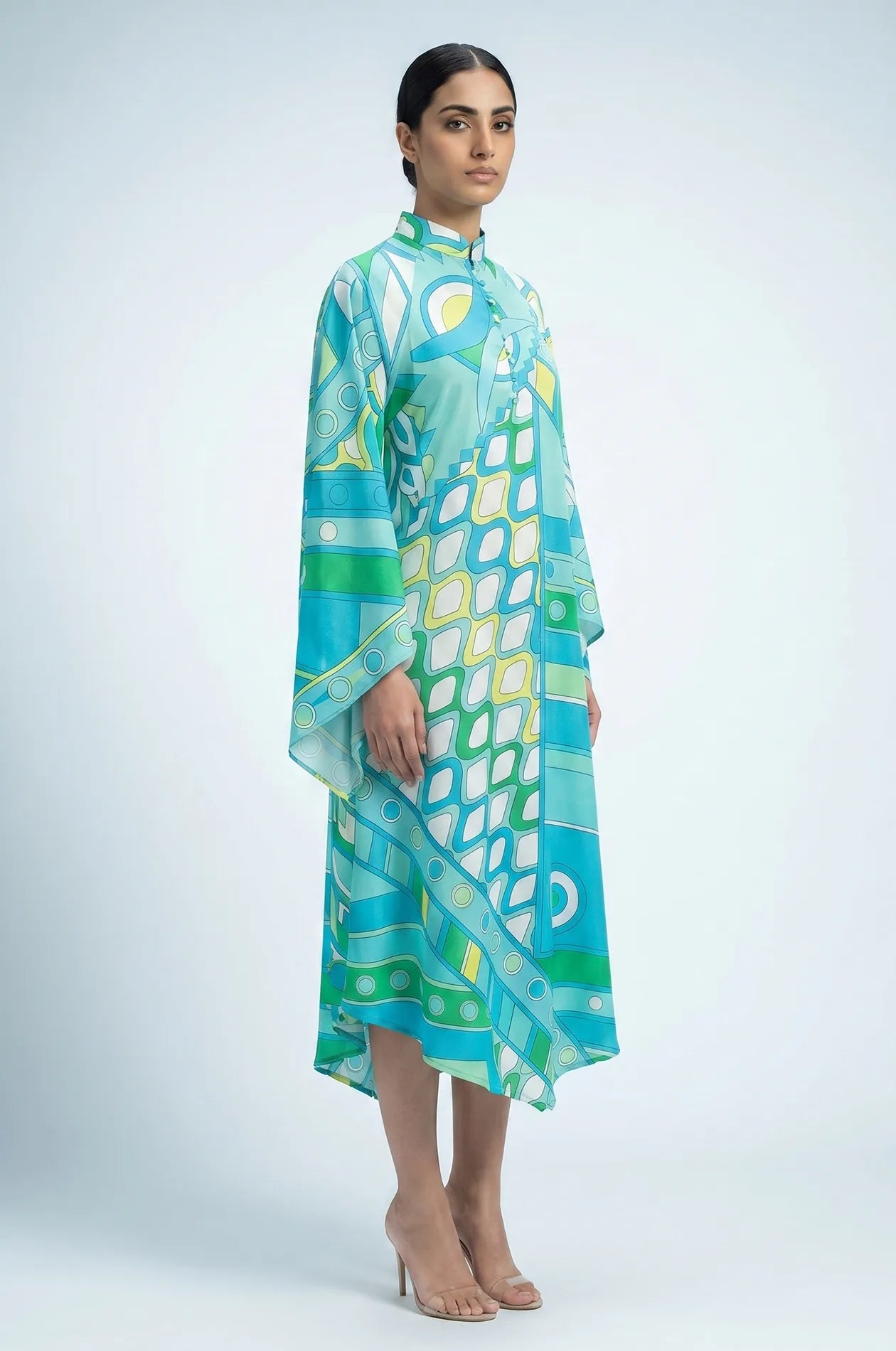 Left side view of Naylara Myrtle teal geometric kaftan showing cape sleeve and asymmetric hem