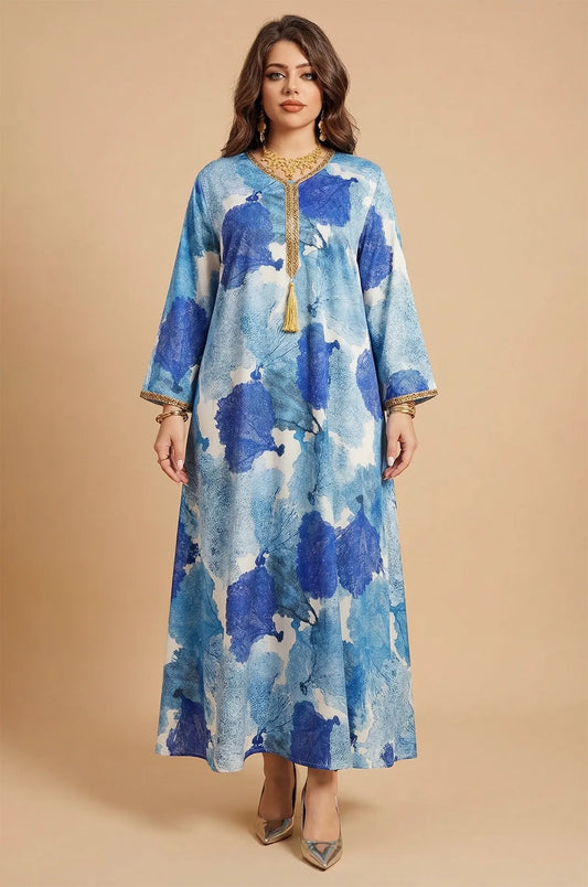Full front view of the Navae blue tropical print kaftan with gold tassel and braided trim.