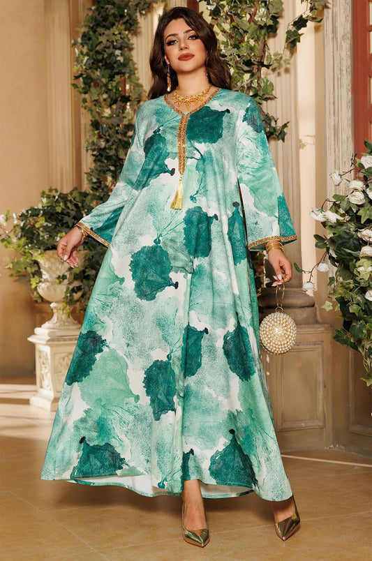 Model wearing the Navae green tropical print kaftan styled with a luxury pearl sphere clutch bag.