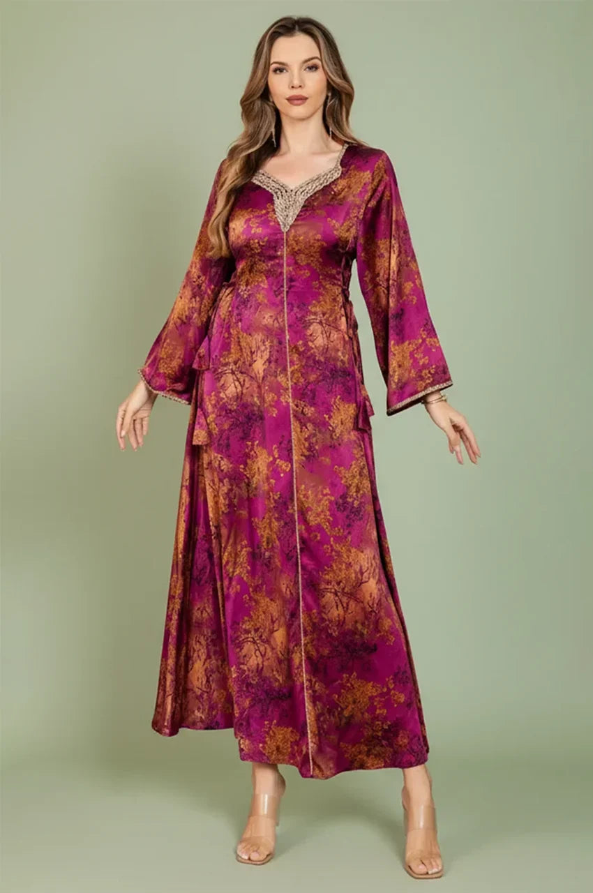 Full front view of the Noria fuchsia red fitted kaftan featuring gold floral patterns and traditional sfifa braiding.