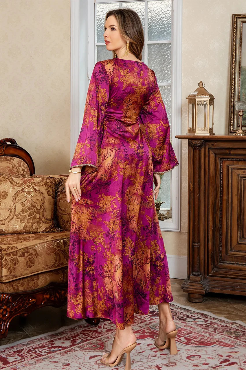 Noria fuchsia red fitted kaftan styled in a luxury interior, emphasizing the rich silk-touch texture.