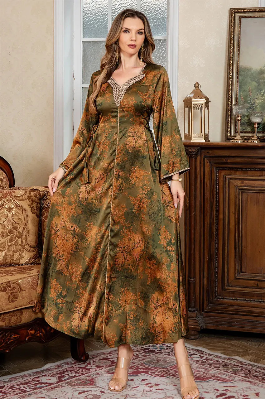 Standing pose in a luxury interior featuring the Noria olive green fitted kaftan with authentic Aakad button details.