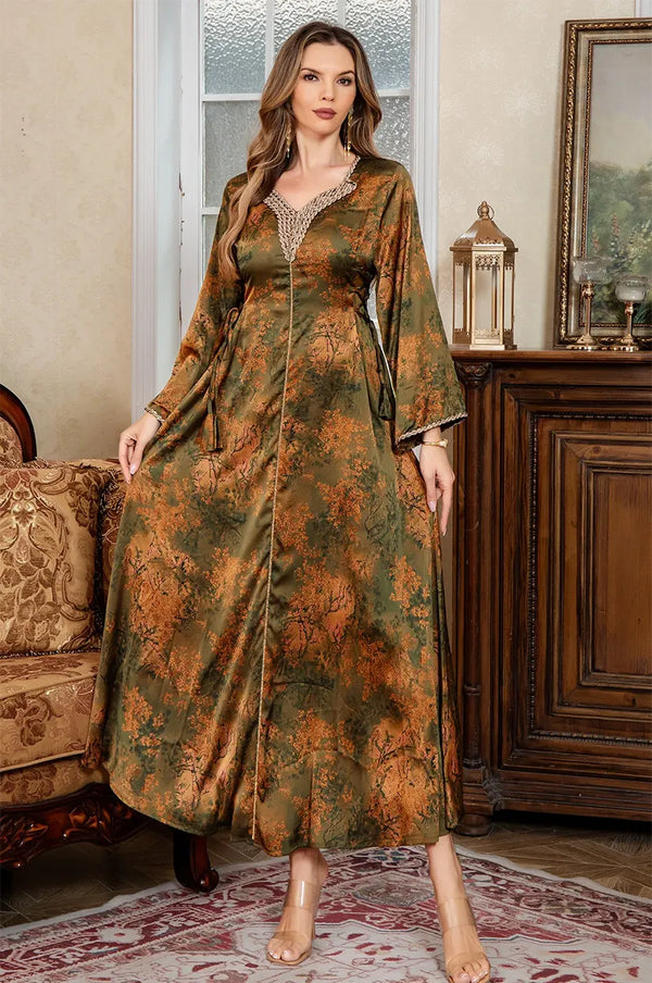 Standing pose in a luxury interior featuring the Noria olive green fitted kaftan with authentic Aakad button details.