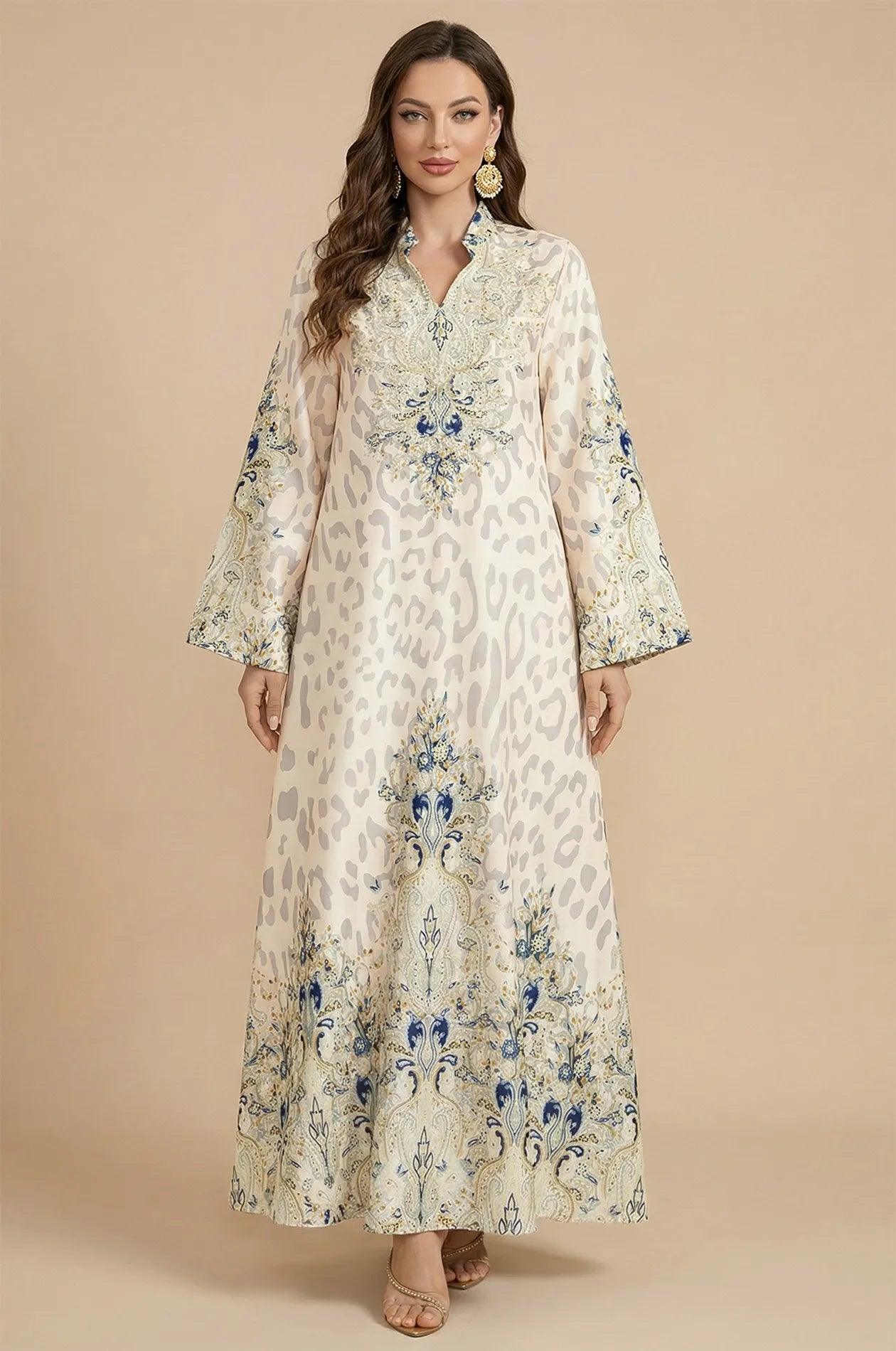 Full front view of the Nyx White Animal Print Kaftan by Naylara, featuring a luxurious leopard pattern and striking blue paisley borders.