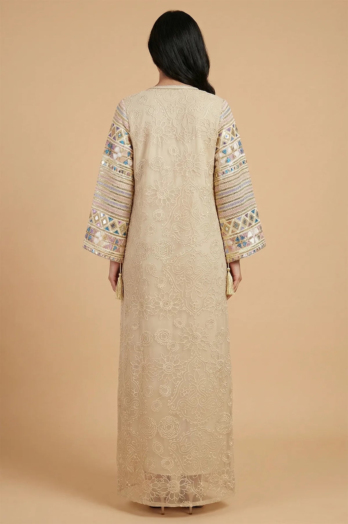 Back view of the Orla apricot beige bell sleeve kaftan showcasing the symmetrical floor-length lace pattern.