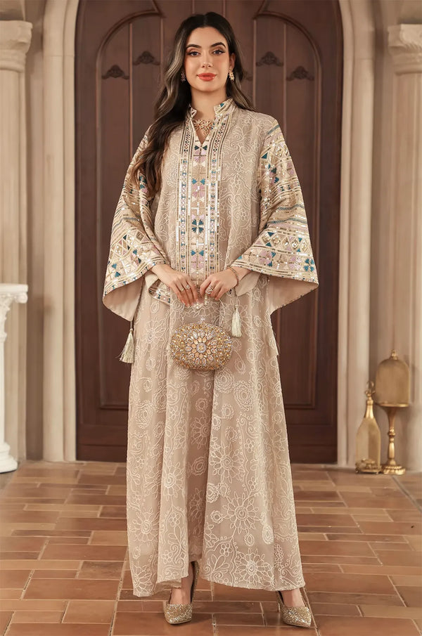 Formal evening styling of the Orla apricot beige bell sleeve kaftan featuring a luxury gold embellished bag.
