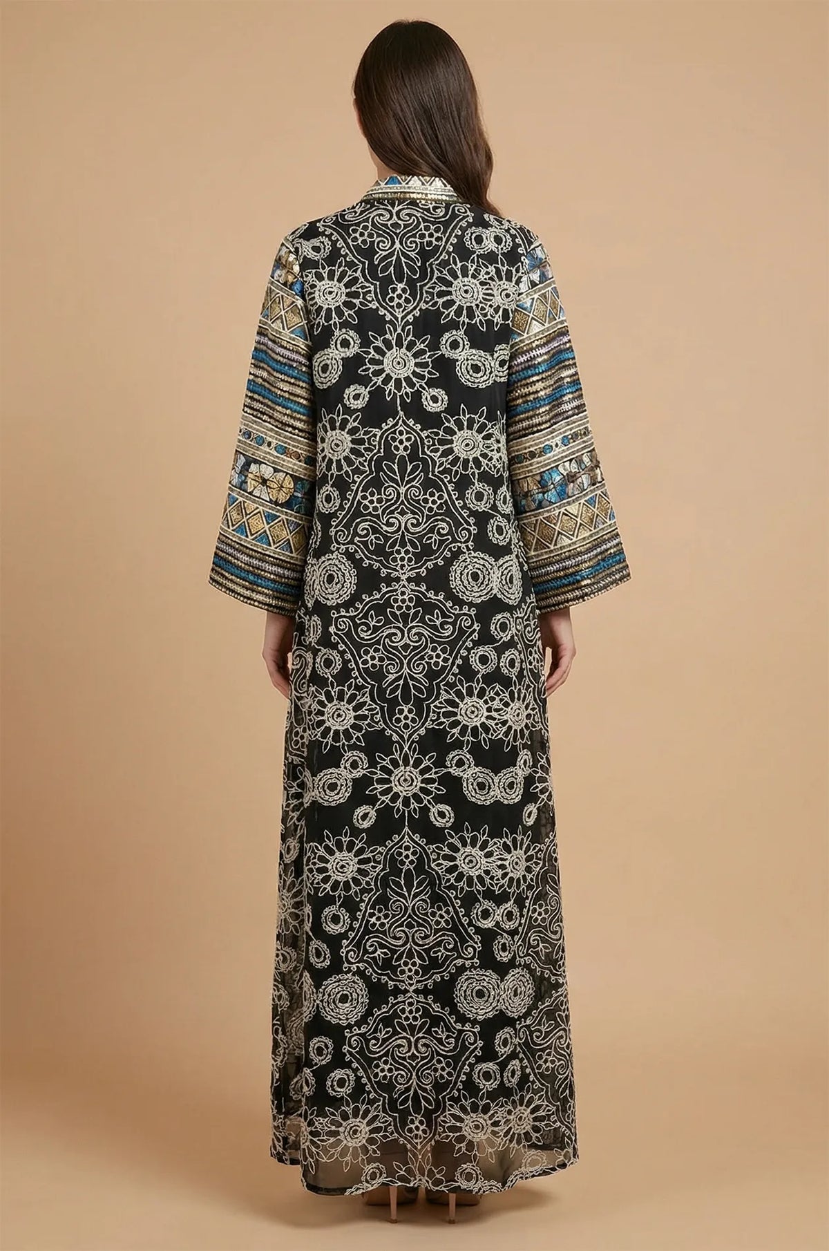 The back view of the Naylara Orla black bell sleeve kaftan highlighting the symmetrical floral lace pattern and structured fit.