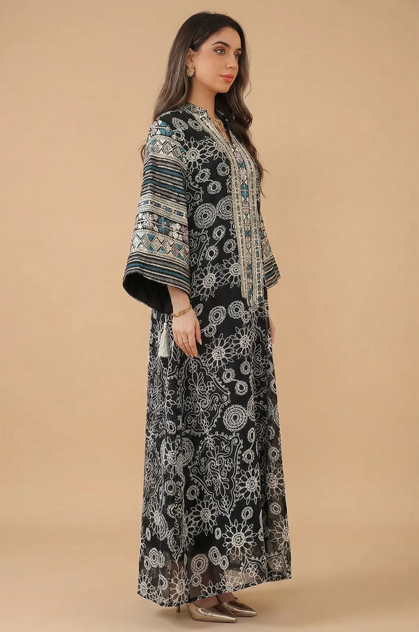 Side profile of the Orla black bell sleeve kaftan showcasing the dramatic sleeve volume and metallic geometric sleeve borders.