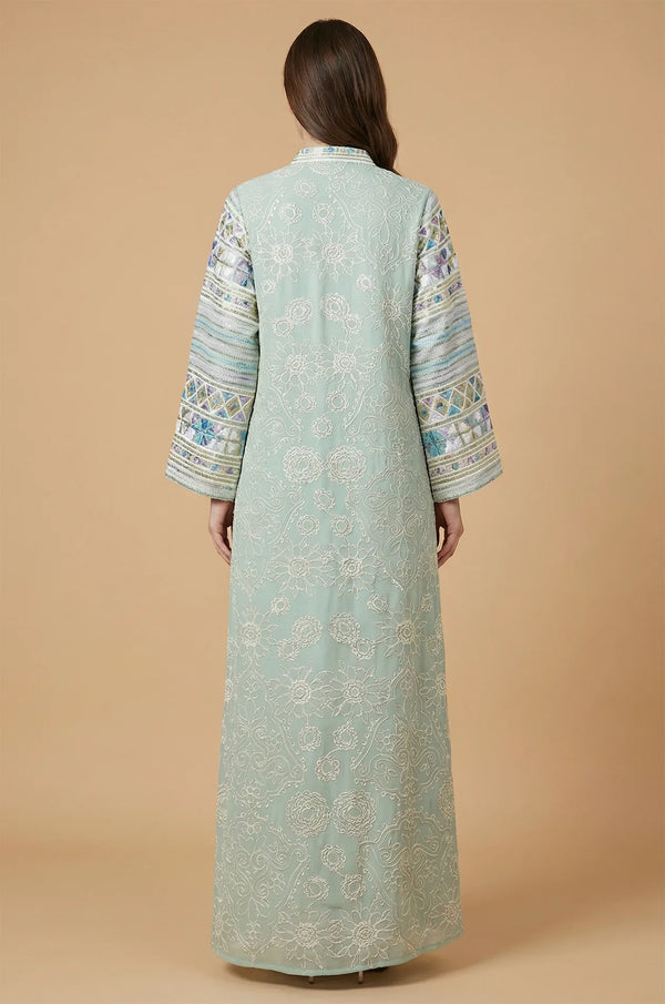 Back view of the Orla light green bell sleeve kaftan showing the floor-length floral lace pattern and relaxed fit.